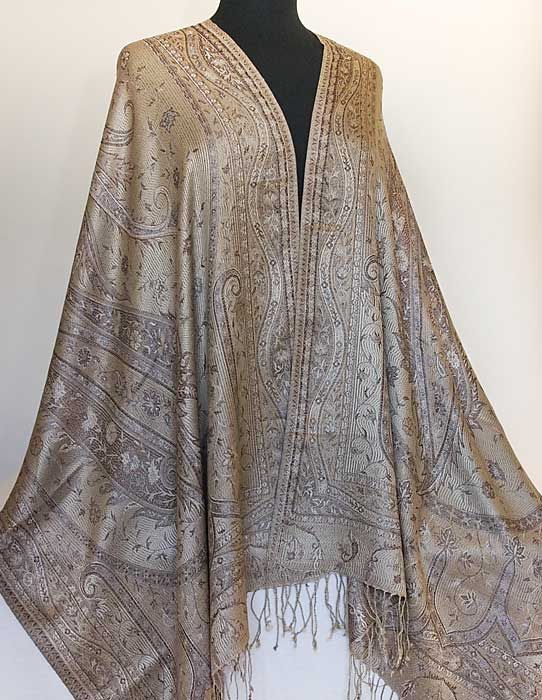 This is an elegant, light weight shawl with a jacquard woven, jamavar 